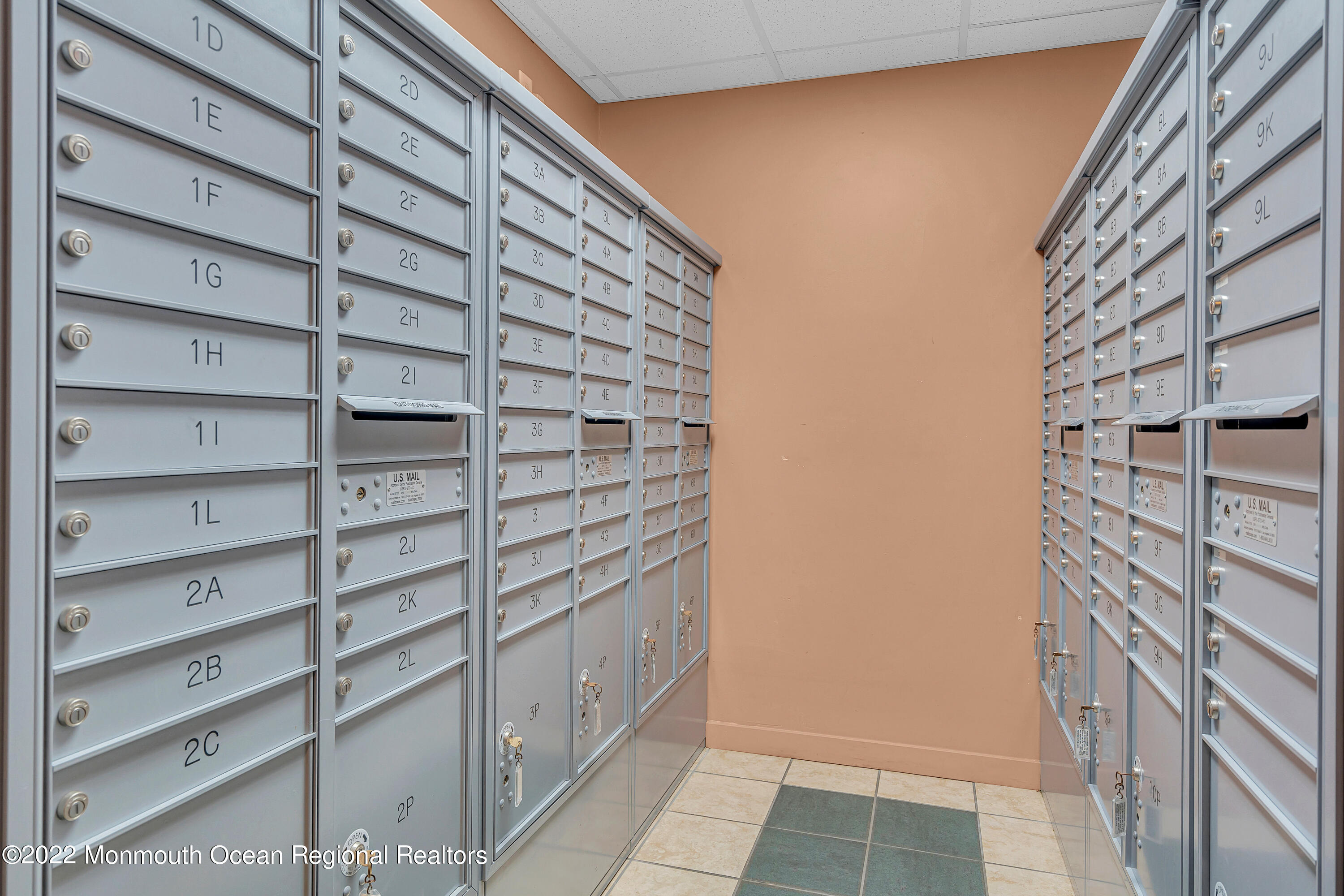 1000 River Road, Unit 7B Belmar, NJ 07719 - Photo 19 of 38 a view of entryway with wooden wall and windows