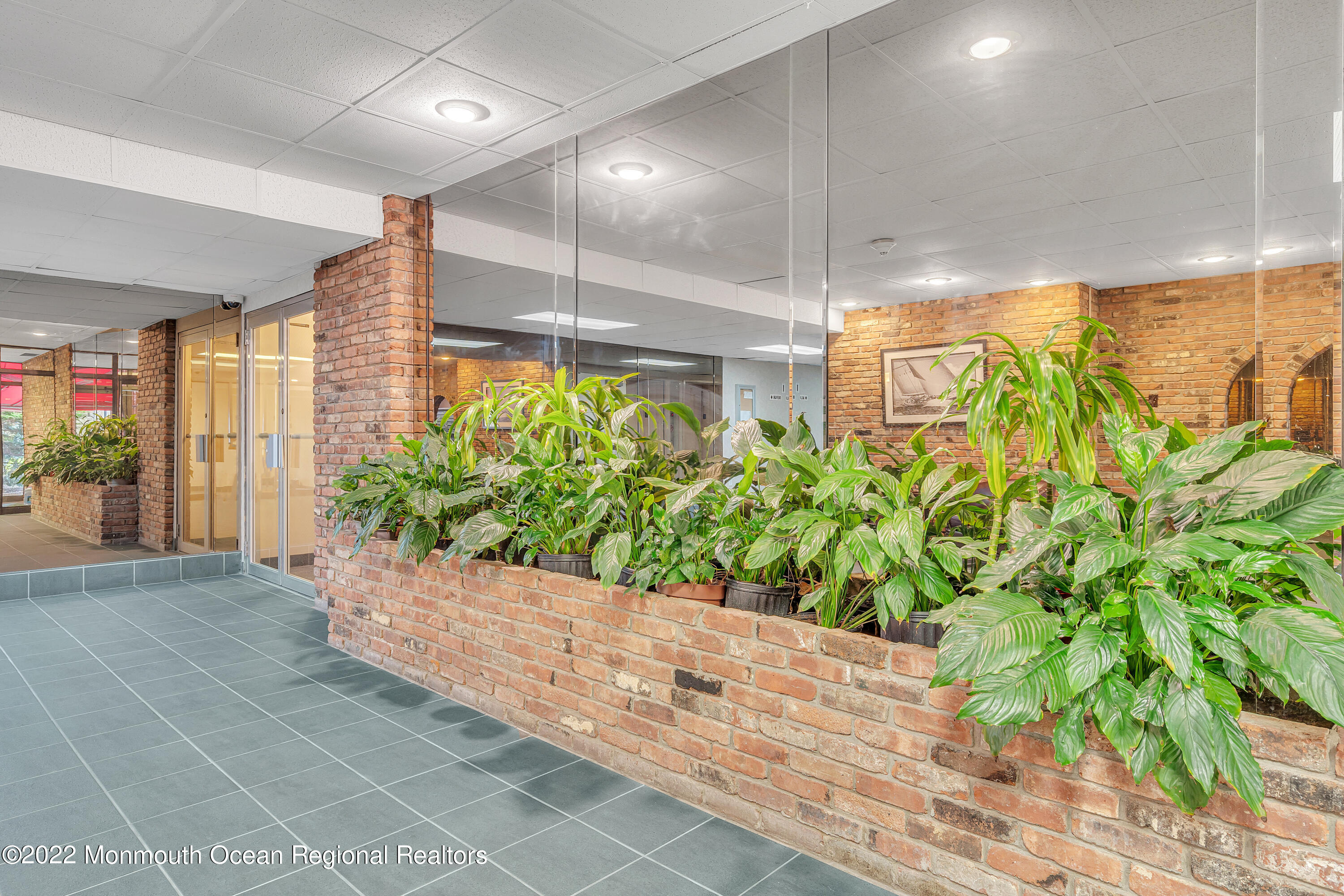 1000 River Road, Unit 7B Belmar, NJ 07719 - Photo 21 of 38 a yellow room with potted plants