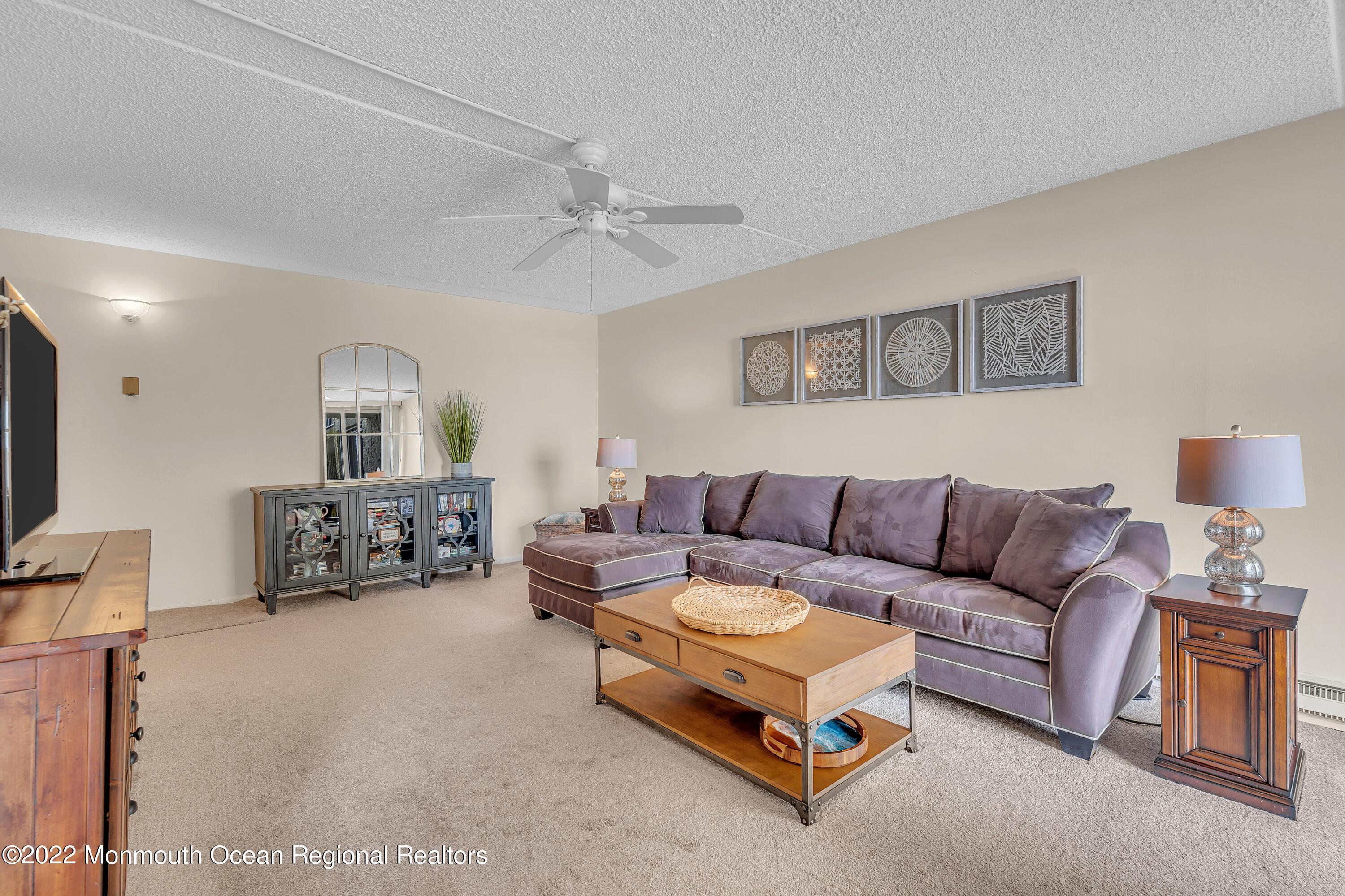 1000 River Road, Unit 7B Belmar, NJ 07719 - Photo 6 of 38 a living room with furniture and a couch