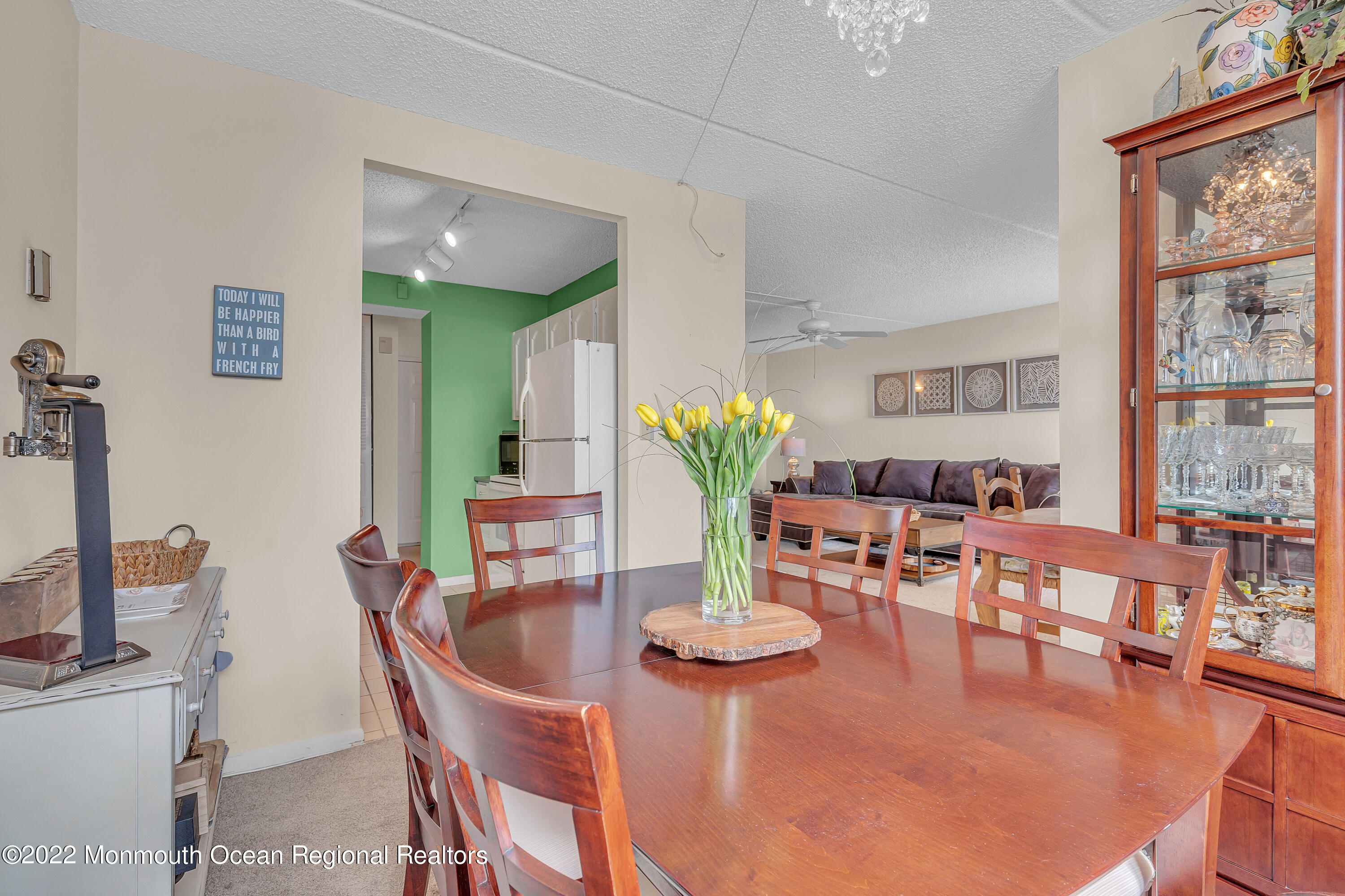 1000 River Road, Unit 7B Belmar, NJ 07719 - Photo 10 of 38 a dining room with furniture and wooden floor