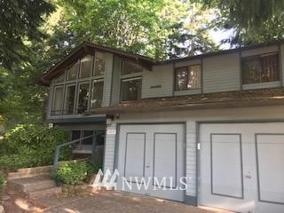 10939 Southeast 183rd Court Renton, WA 98055 - Photo 1 of 28 a front view of a house with a garden