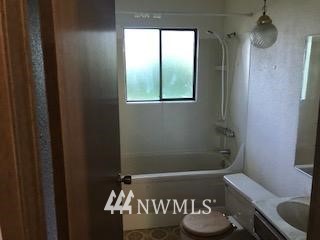 10939 Southeast 183rd Court Renton, WA 98055 - Photo 7 of 28 a bathroom with a toilet and a shower