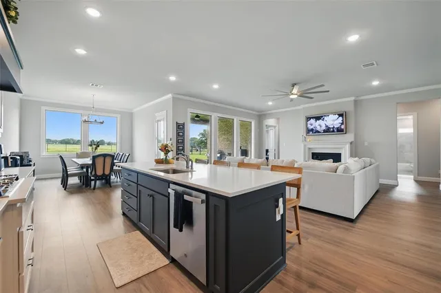 a large kitchen with a table and chairs