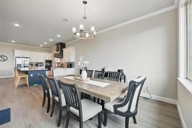 a kitchen with stainless steel appliances granite countertop a sink dishwasher stove and refrigerator