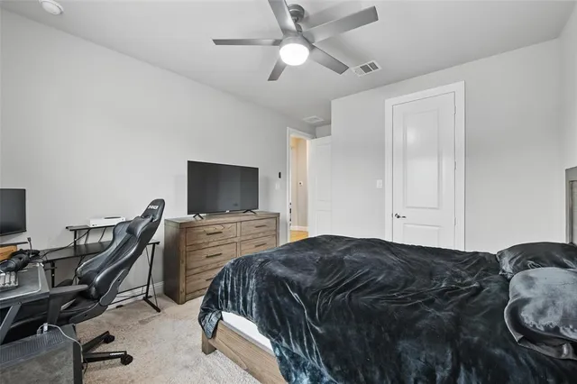 a view of a dining room with furniture a chandelier and wooden floor