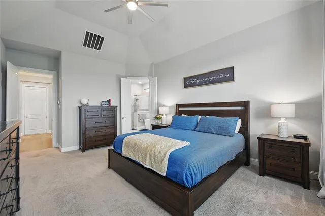 a bedroom with a bed dresser and a window