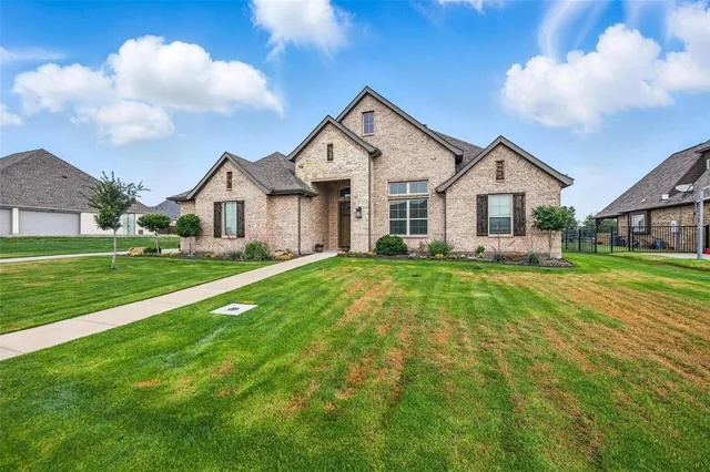 a spacious bathroom with a tub sink and mirror