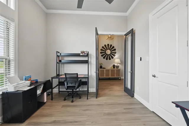 a bedroom with a bed a desk and chair