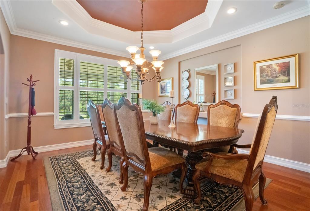 5785 Gilliam Road Orlando, FL 32818 - Photo 14 of 100 a view of a dining room with furniture window and wooden floor