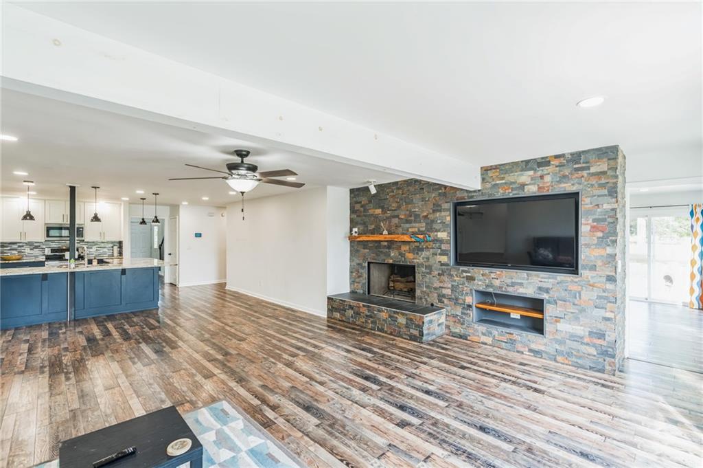 500 Coleman Mill Road Carrollton, GA 30116 - Photo 15 of 83 a living room with furniture and a flat screen tv