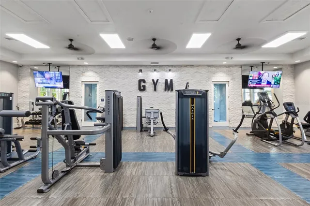 a dining room with furniture and a floor to ceiling window
