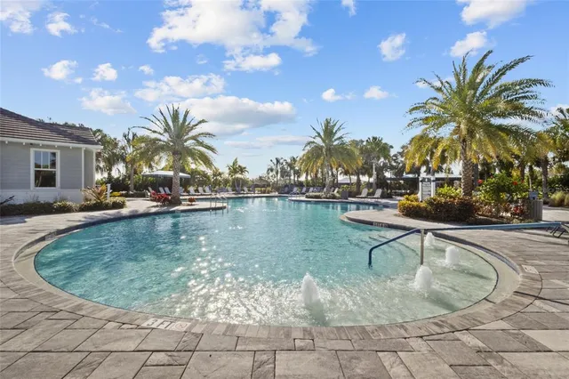 a view of a patio with a dining table and chairs