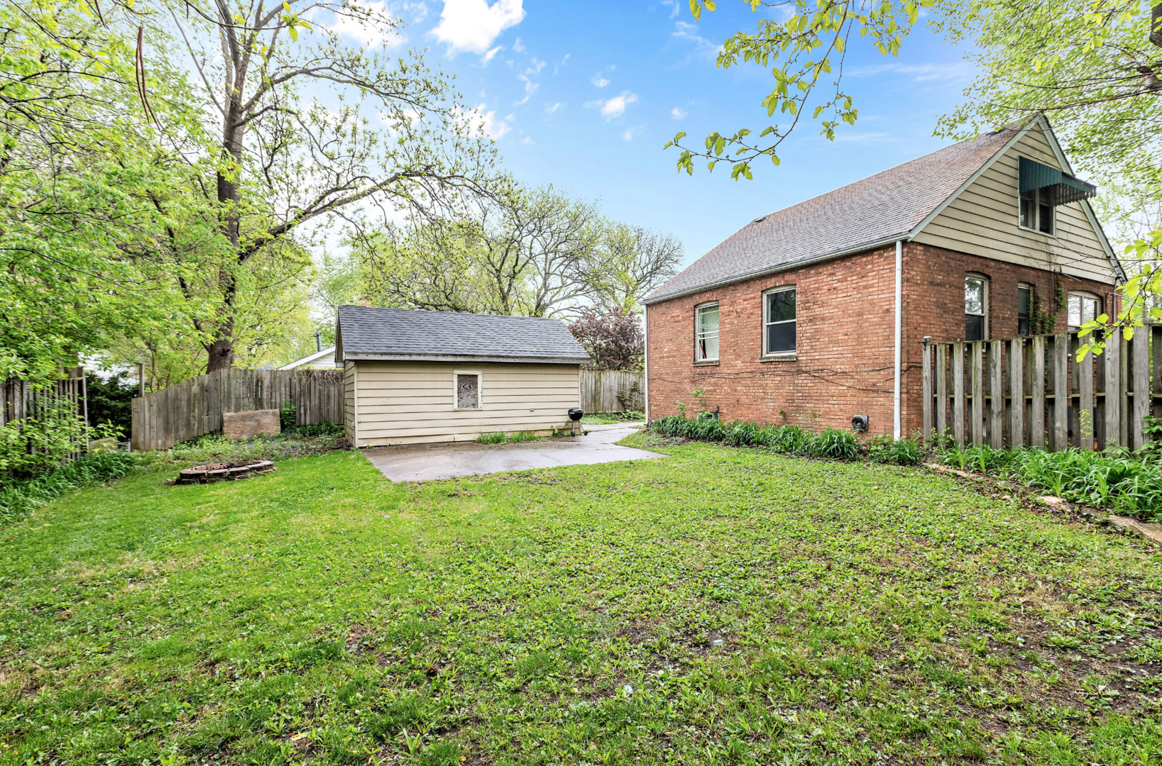 389 West 12th Street Chicago Heights, IL 60411 - Photo 15 of 15 a view of a house with backyard and sitting area