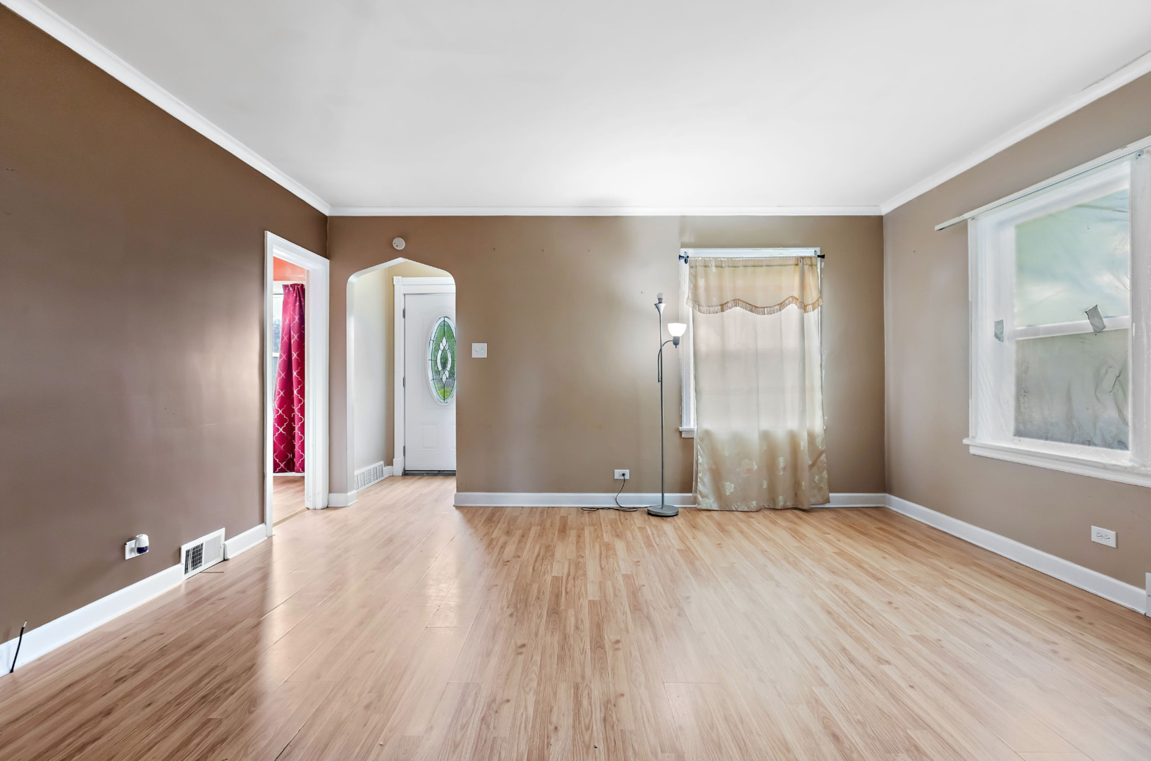 389 West 12th Street Chicago Heights, IL 60411 - Photo 3 of 15 an empty room with wooden floor and windows