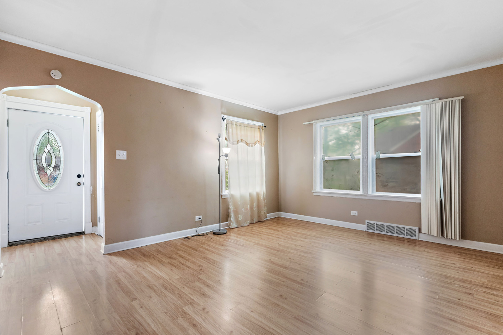 389 West 12th Street Chicago Heights, IL 60411 - Photo 5 of 15 an empty room with wooden floor and windows
