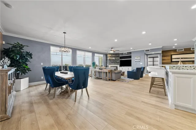 a large kitchen with a table and chairs