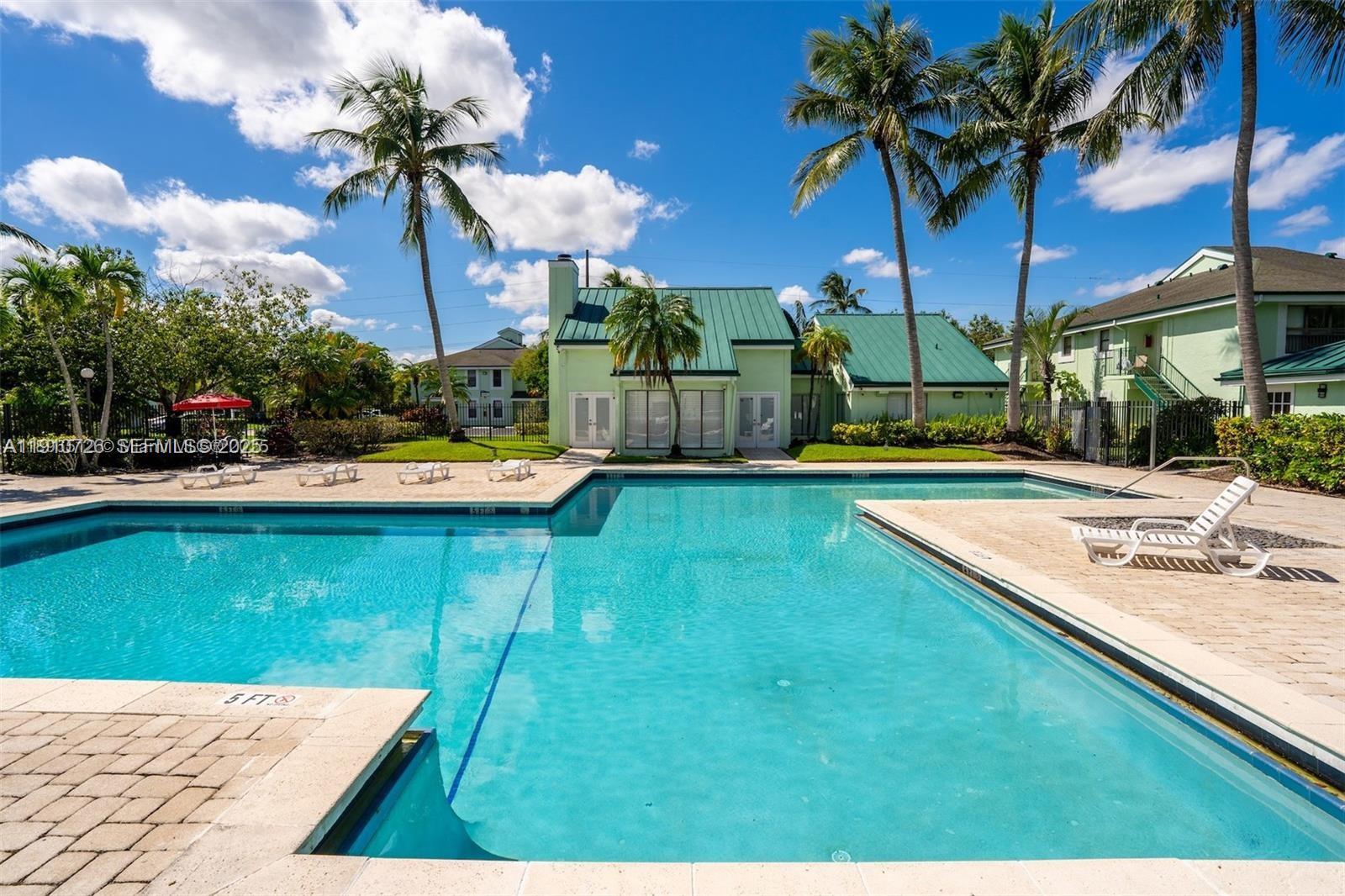 4086 North Pine Island Road, Unit 508 Sunrise, FL 33351 - Photo 2 of 13 a view of a house with a swimming pool