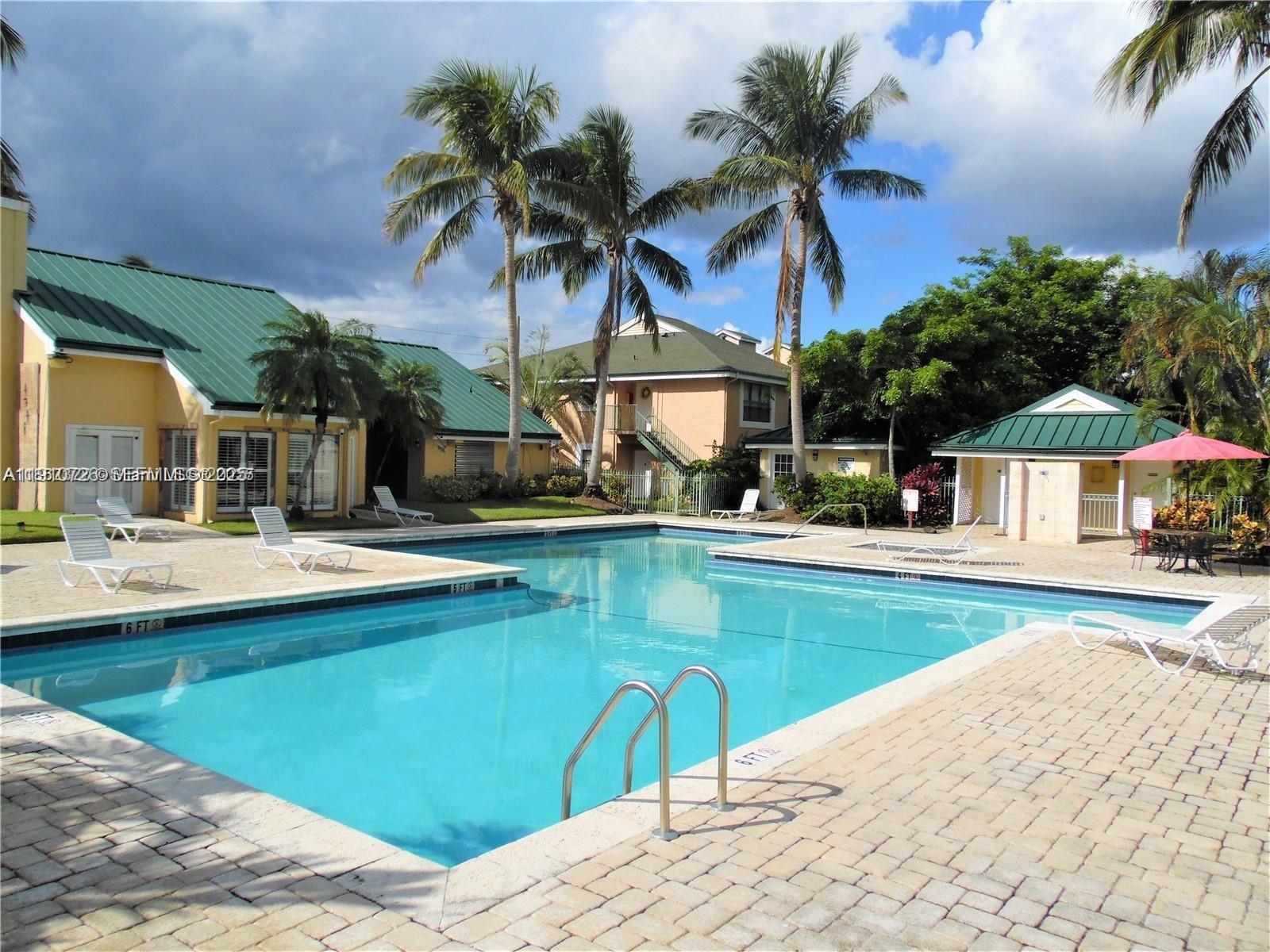 4086 North Pine Island Road, Unit 508 Sunrise, FL 33351 - Photo 3 of 13 a view of a house with swimming pool and sitting area