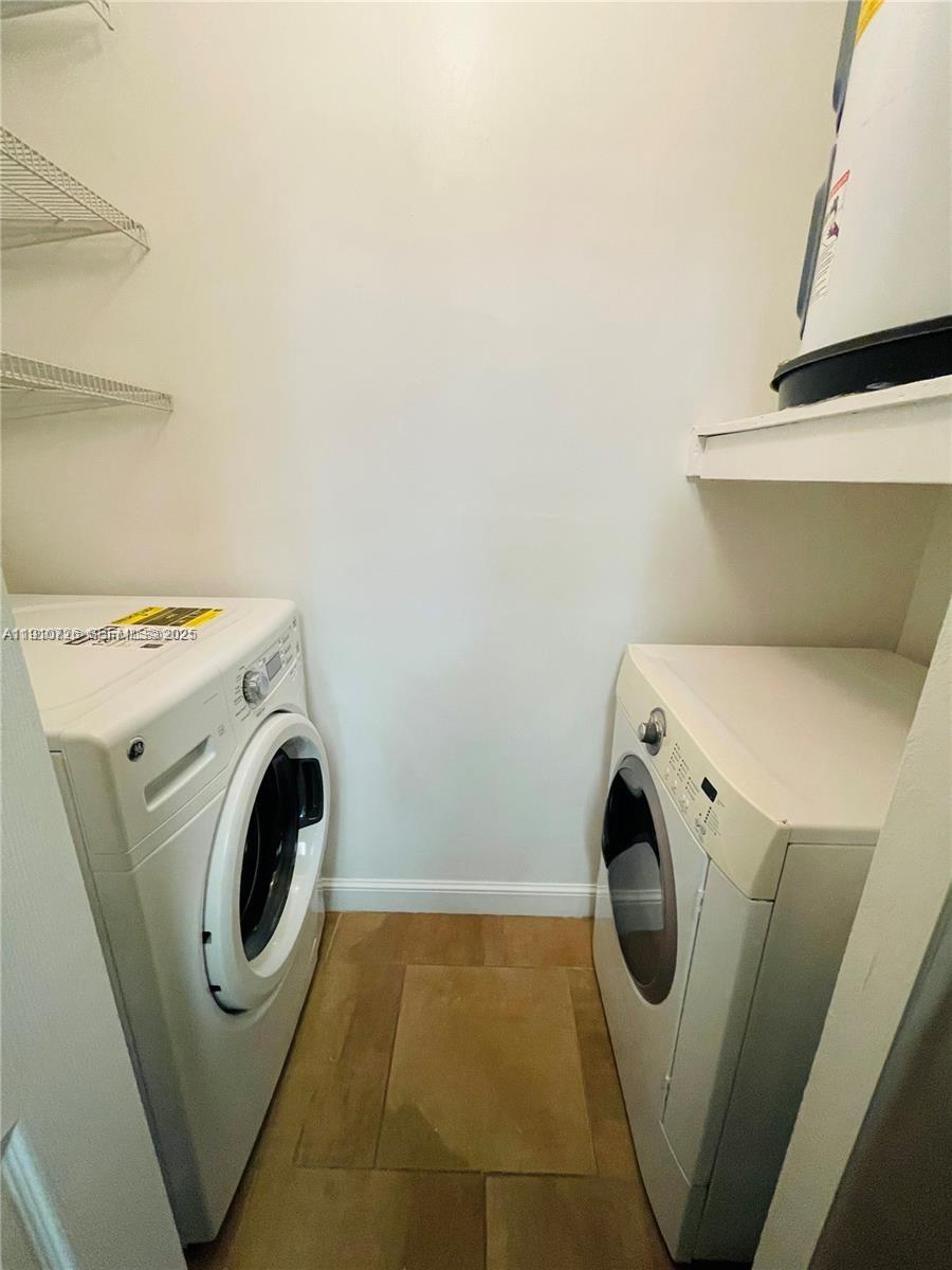 4086 North Pine Island Road, Unit 508 Sunrise, FL 33351 - Photo 6 of 13 a utility room with dryer and washer