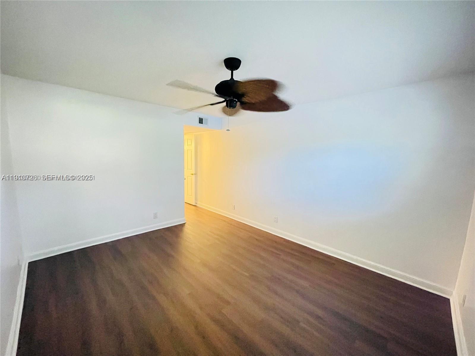 4086 North Pine Island Road, Unit 508 Sunrise, FL 33351 - Photo 9 of 13 a view of entryway with wooden floor