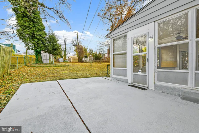 a view of room with window and ceiling fan
