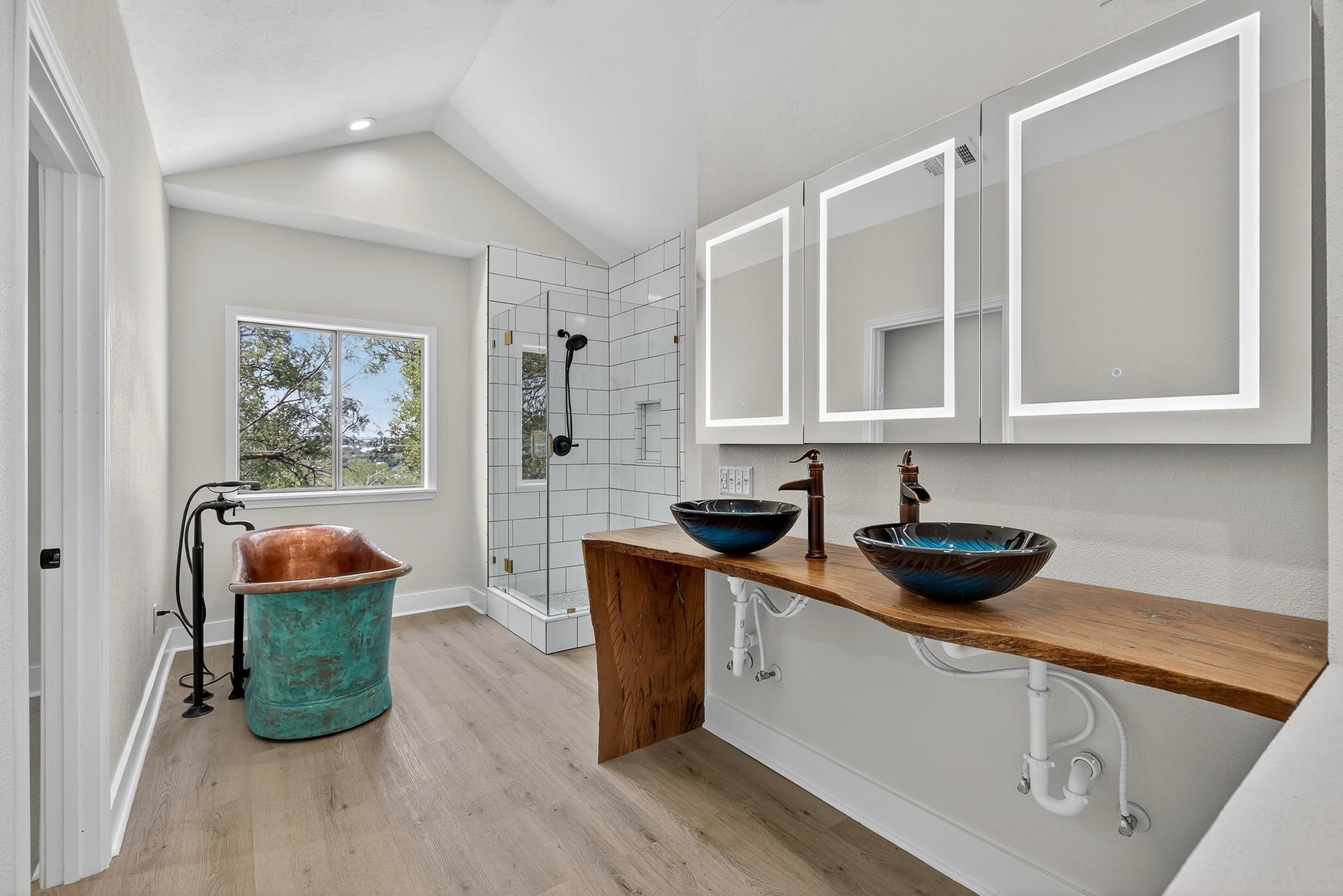95 Gateway North Marble Falls, TX 78654 - Photo 15 of 30 a kitchen with stainless steel appliances granite countertop a sink and a stove with wooden floor