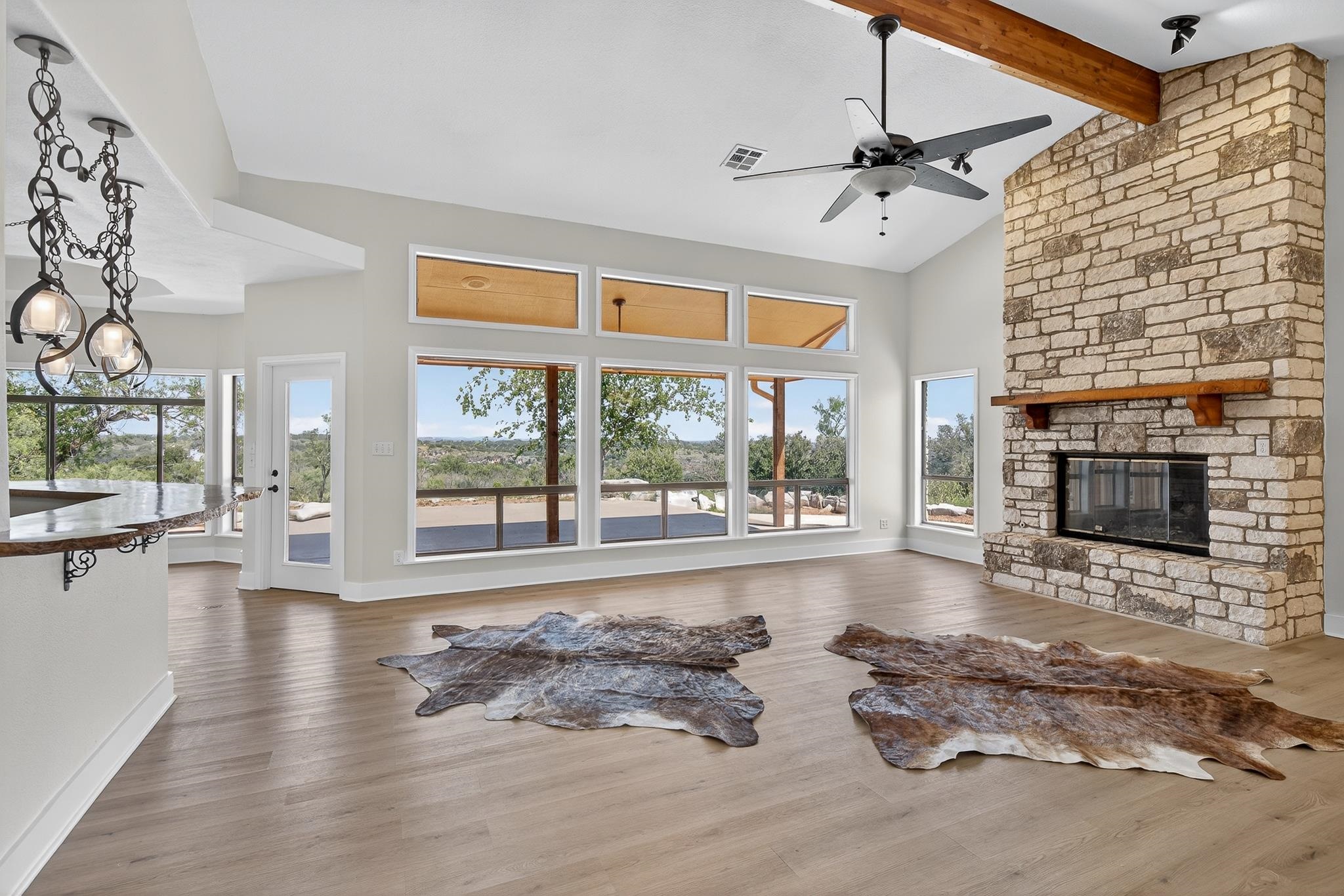 95 Gateway North Marble Falls, TX 78654 - Photo 4 of 30 a living room with furniture large window and a fireplace