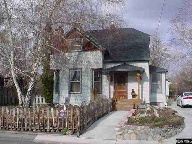 a front view of a house with garage
