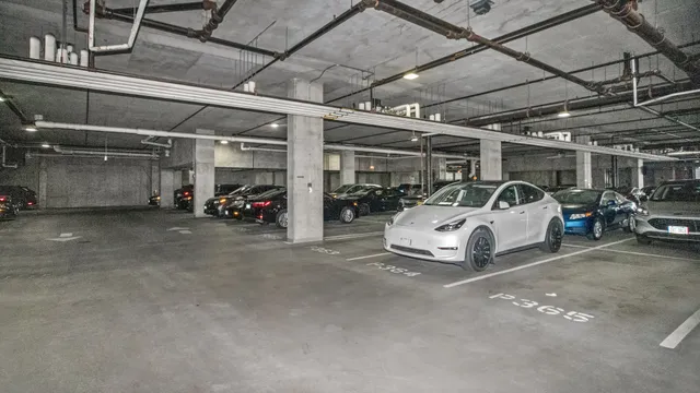 a view of parking garage with cars