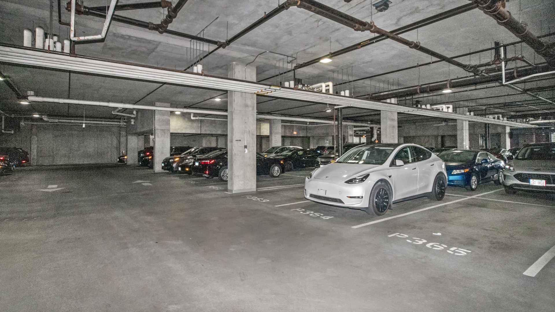 659 West Randolph Street, Unit 510 Chicago, IL 60661 - Photo 7 of 10 a view of parking garage with cars