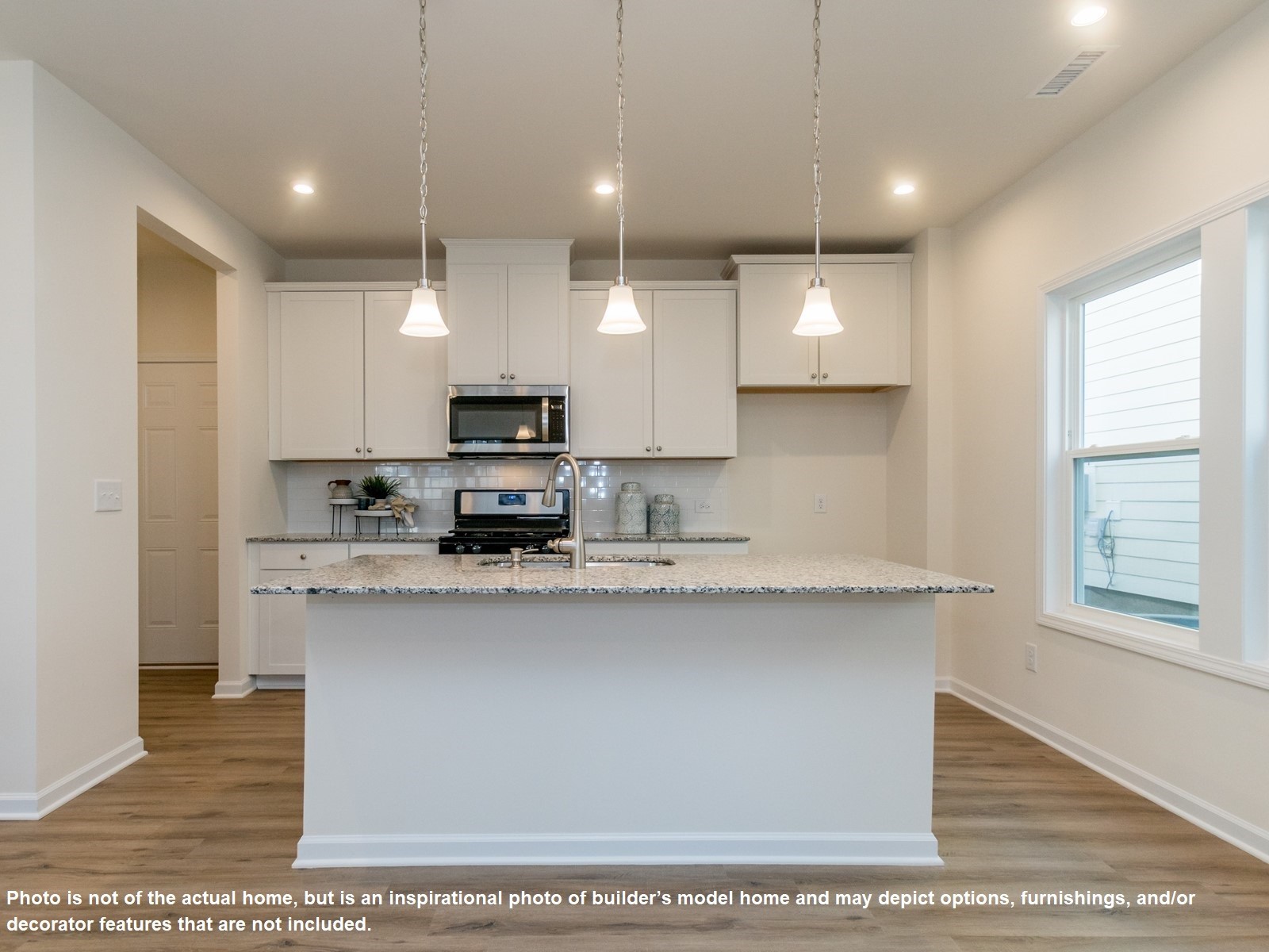 2092 Notchleaf Road Antioch, TN 37013 - Photo 6 of 12 a kitchen with kitchen island a sink stainless steel appliances and cabinets