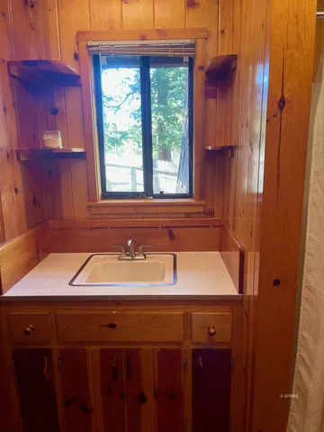a bathroom with a sink and a window
