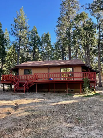 a view of a house with a yard and garage