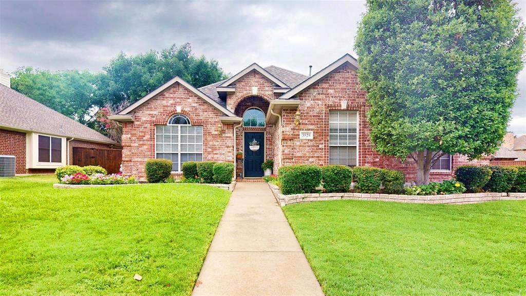 3528 Kales Lane Flower Mound, TX 75022 - Photo 1 of 1 a front view of a house with a yard and potted plants