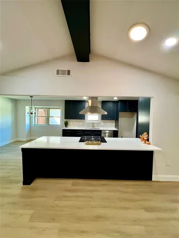 a view of living room with furniture and flat screen tv