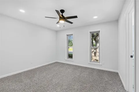 a view of empty room with windows