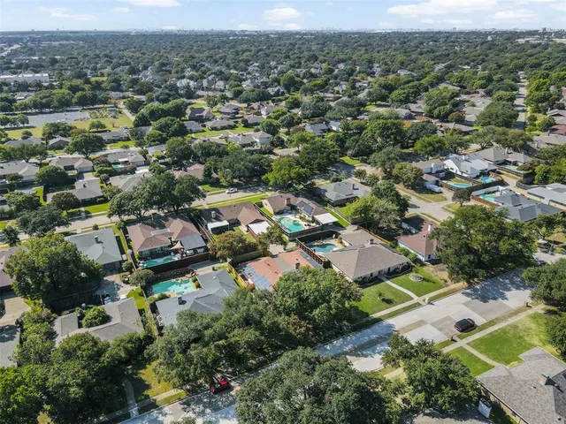 an aerial view of a city with lots of residential buildings