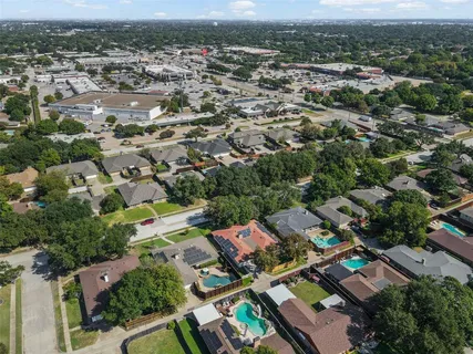an aerial view of a city with lots of residential buildings