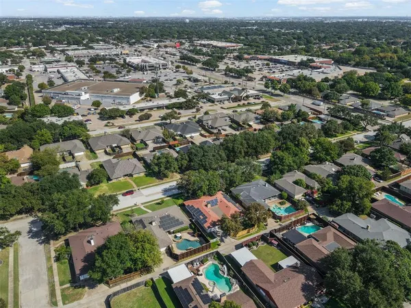 an aerial view of a city with lots of residential buildings