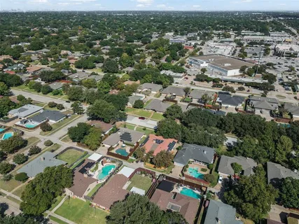 an aerial view of a city with lots of residential buildings