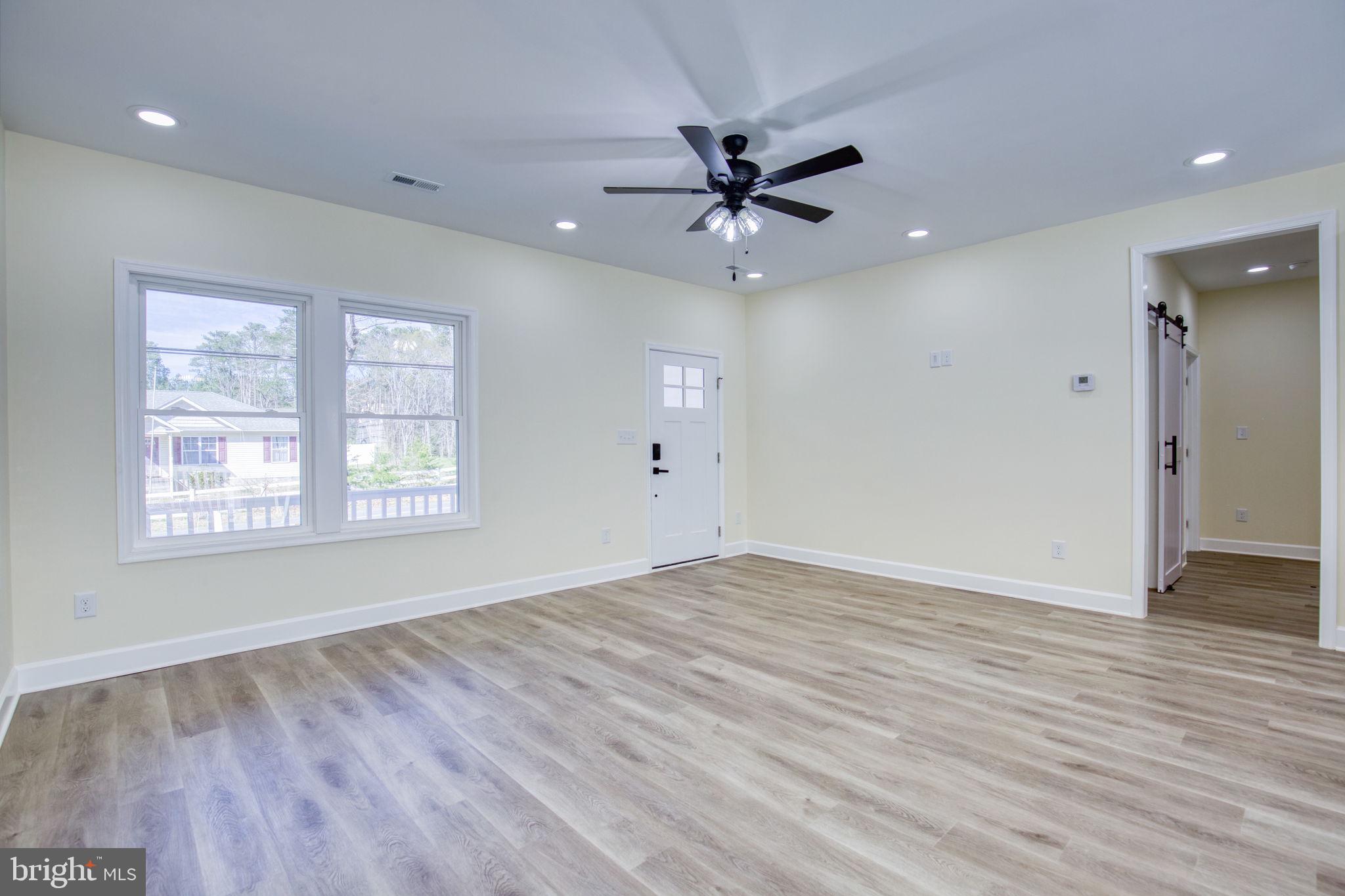 49 Poplar Lane Colonial Beach, VA 22443 - Photo 11 of 42 wooden floor in an empty room with a window