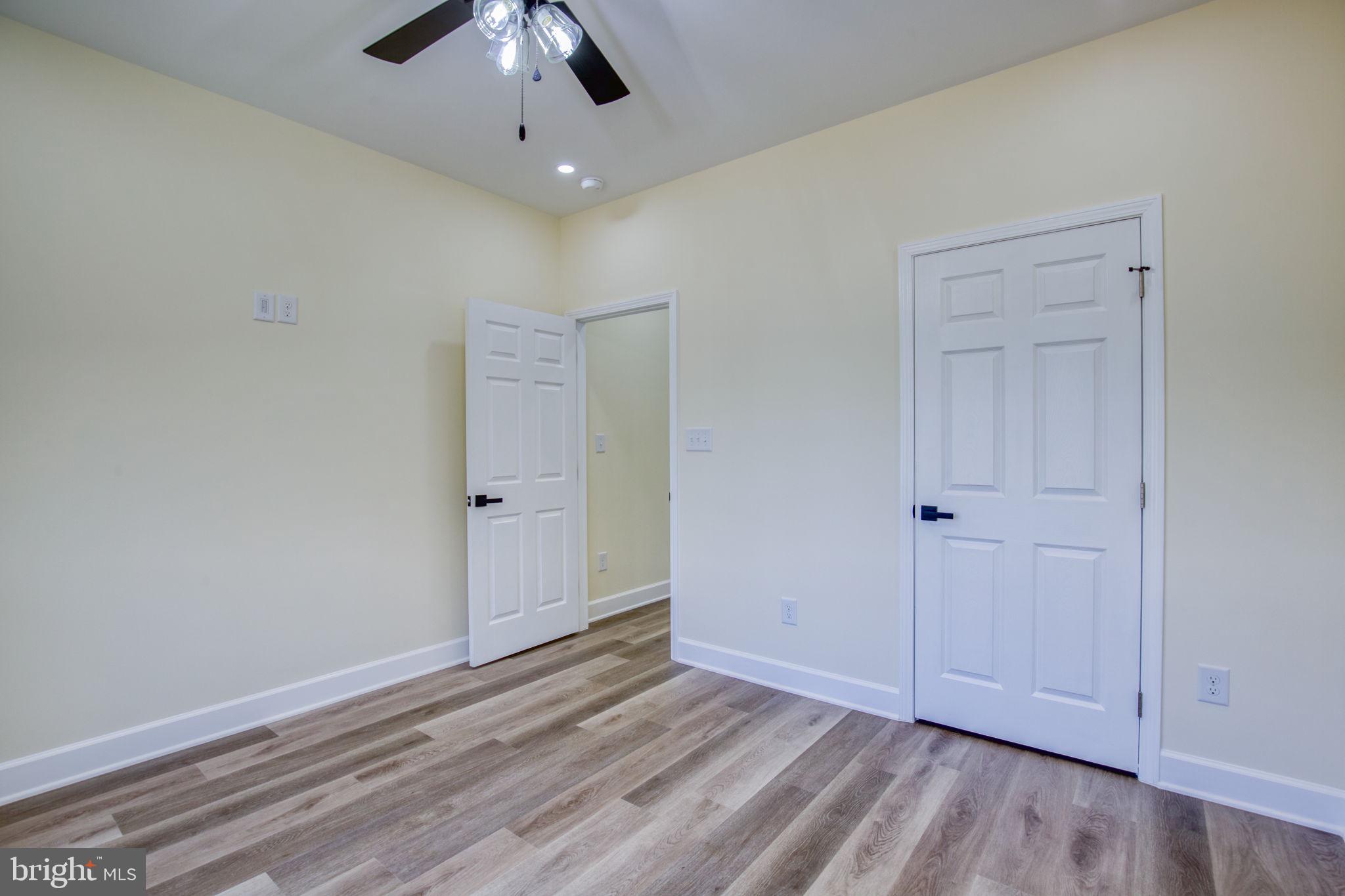 49 Poplar Lane Colonial Beach, VA 22443 - Photo 29 of 42 a view of an empty room and wooden floor