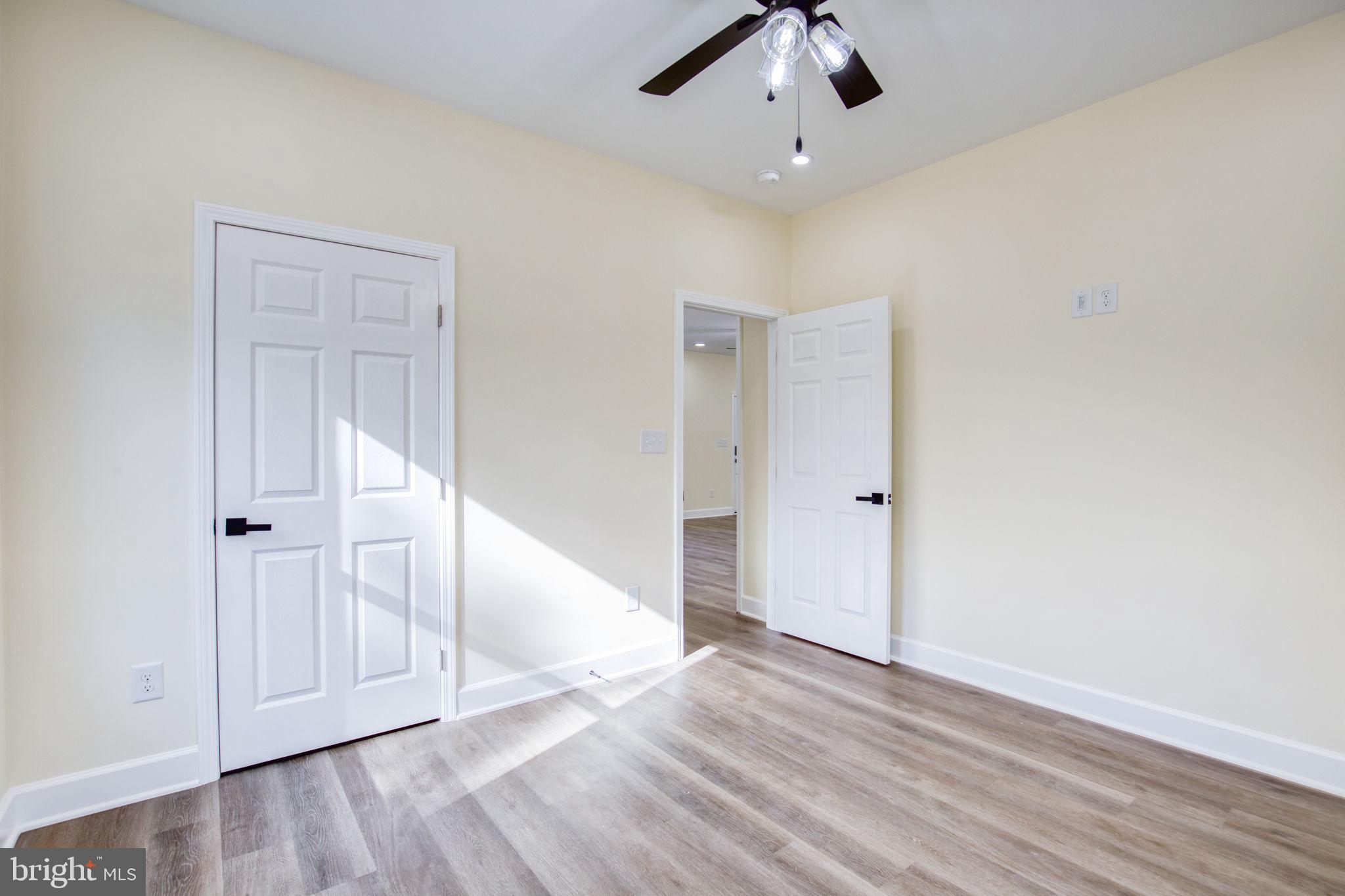 49 Poplar Lane Colonial Beach, VA 22443 - Photo 31 of 42 wooden floor in an empty room with a window