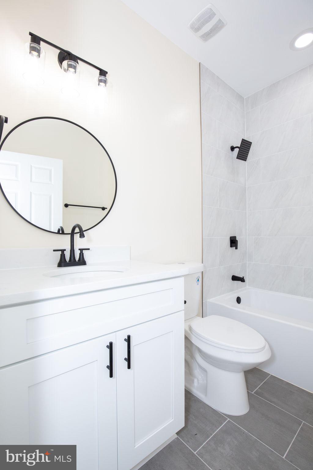 49 Poplar Lane Colonial Beach, VA 22443 - Photo 32 of 42 a bathroom with a sink a toilet and shower