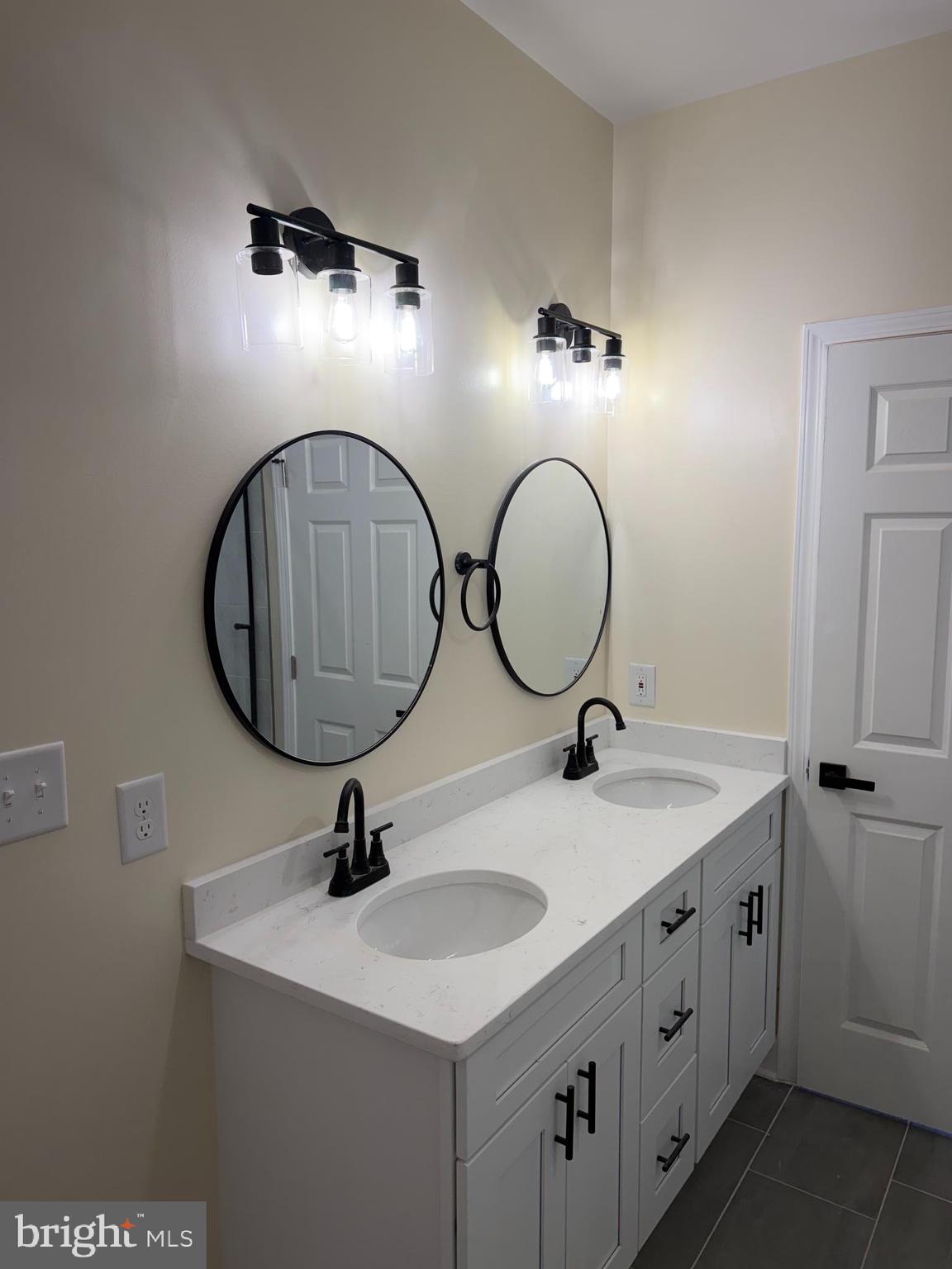 49 Poplar Lane Colonial Beach, VA 22443 - Photo 6 of 9 a bathroom with a sink and a mirror