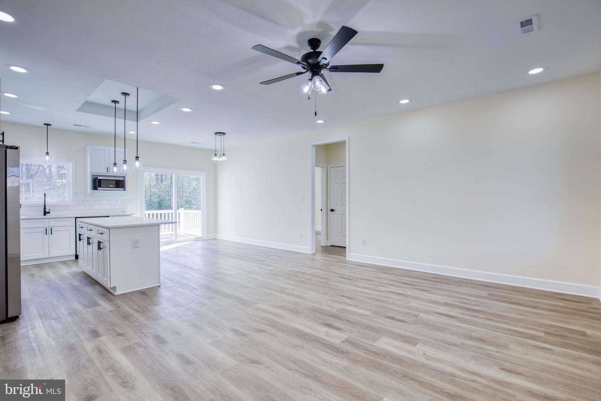 49 Poplar Lane Colonial Beach, VA 22443 - Photo 9 of 42 a view of an empty room with a kitchen