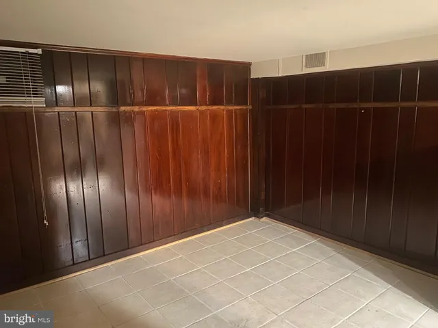 a view of an empty room with shelves