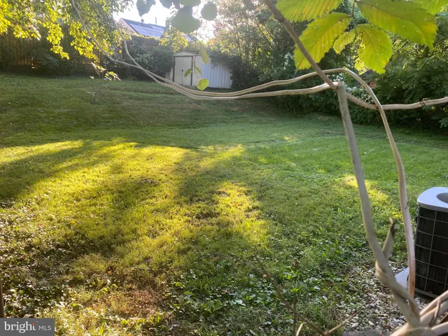 a view of outdoor space with deck and yard