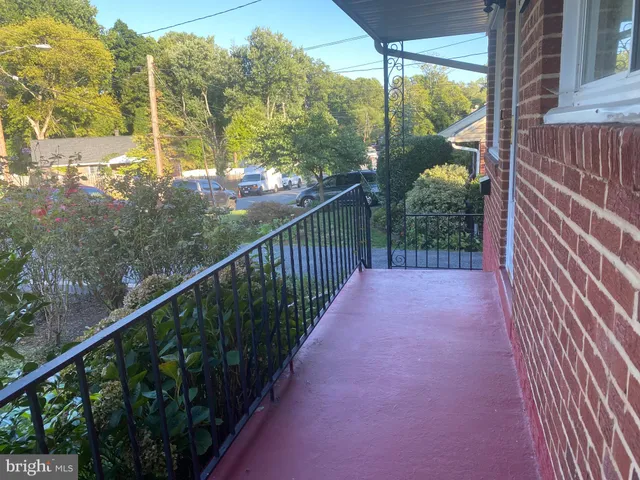 a view of a balcony with trees