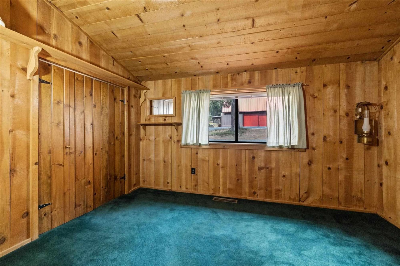 25833 Lyons Dam Road Twain Harte, CA 95383 - Photo 11 of 60 a view of a room with wooden walls